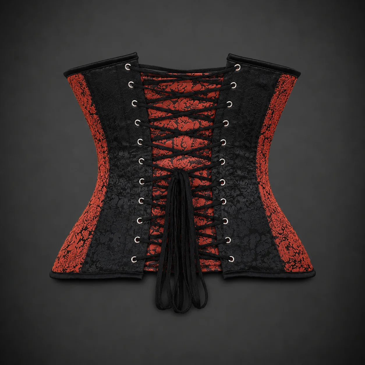 Back product view showing black lace-up adjustment, metal eyelets and alternating red and black brocade corset panels