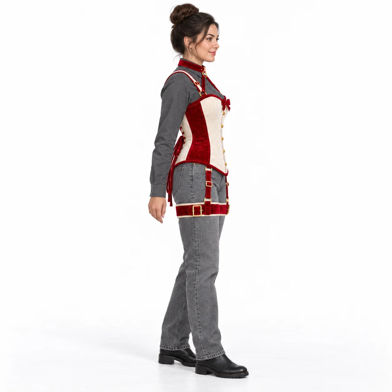 Side profile of a model wearing the two-tone velvet corset with neck collar, shoulder straps and red thigh harness