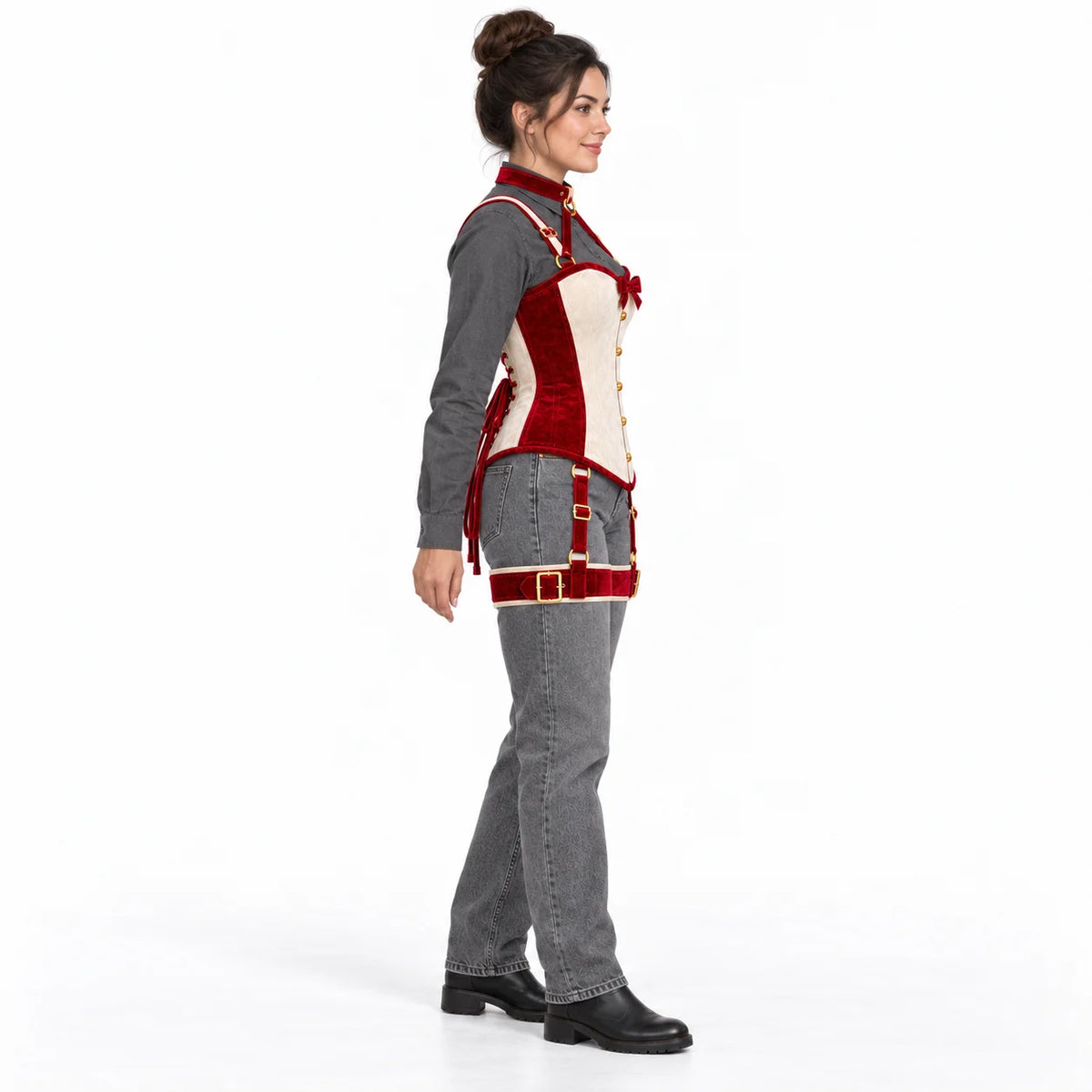 Side profile of a model wearing the two-tone velvet corset with neck collar, shoulder straps and red thigh harness