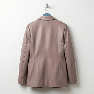 Back view of women’s taupe leather blazer showing tailored seams