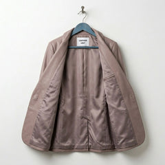 Inside view of women’s taupe leather blazer with full satin lining
