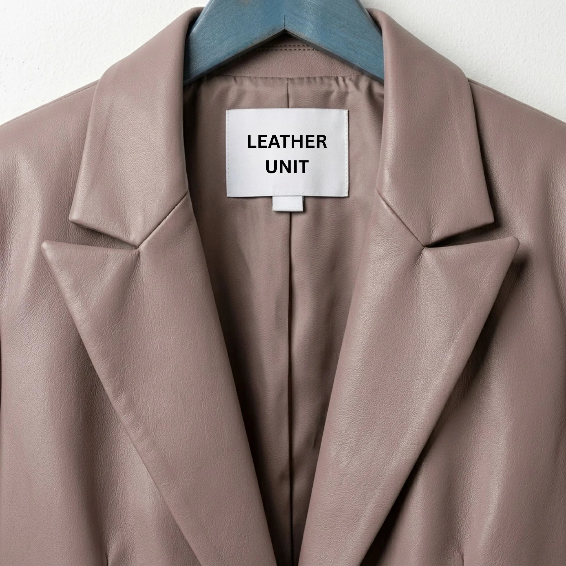 Close up of notch lapels and label on Leather Unit taupe leather blazer